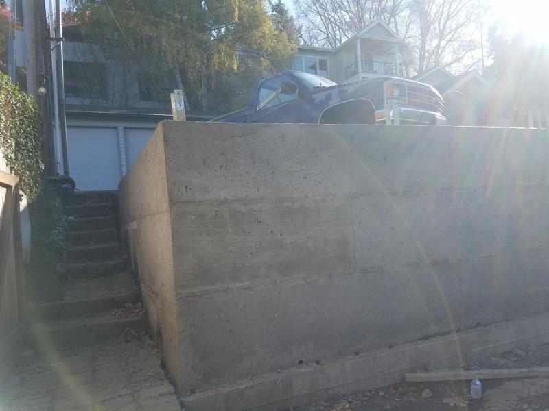 Retaining Walls, Parking Pad, Drain System.