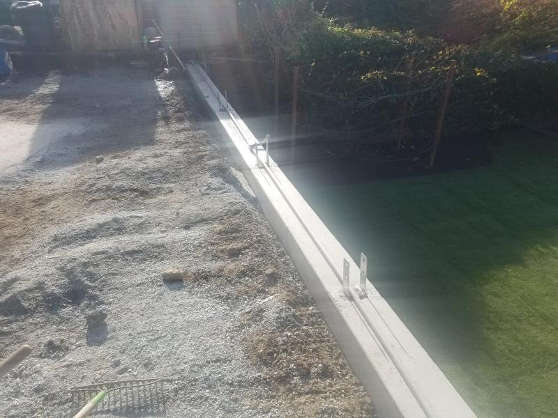 Retaining Walls, Parking Pad, Drain System.