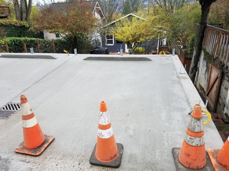 Retaining Walls, Parking Pad, Drain System.