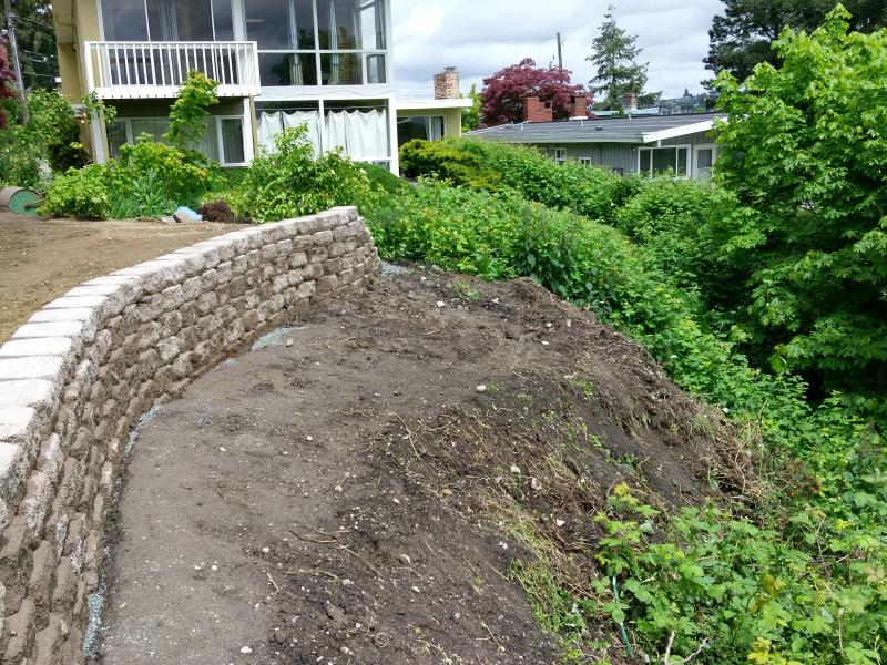  Retaining Walls, Regrading, Sod & Fence Installation.