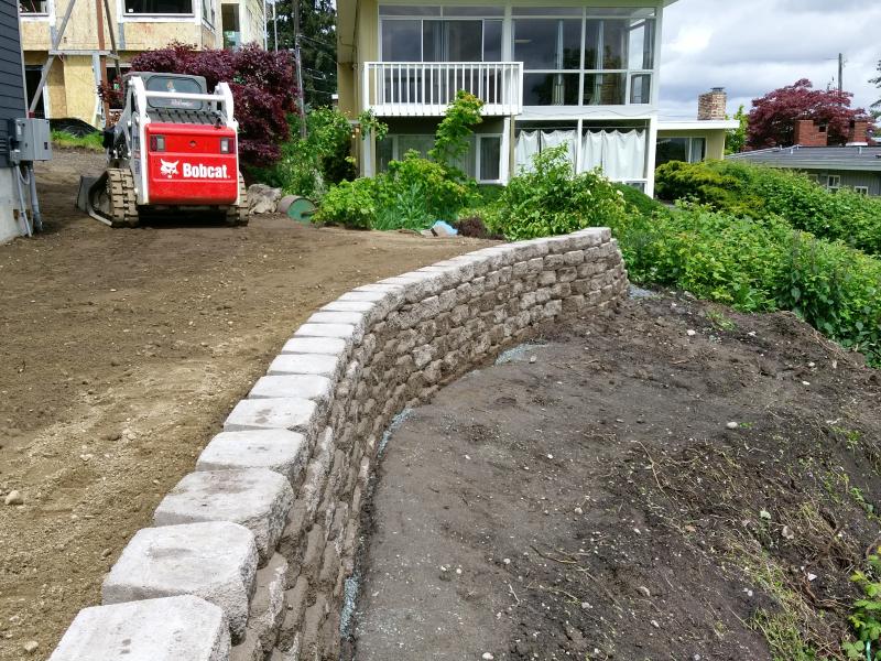  Retaining Walls, Regrading, Sod & Fence Installation.