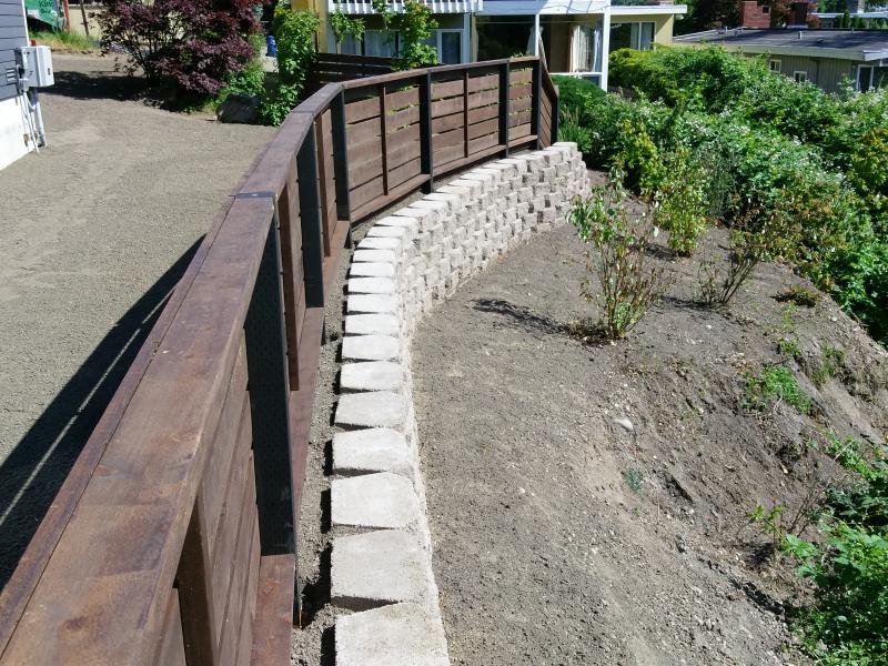  Retaining Walls, Regrading, Sod & Fence Installation.