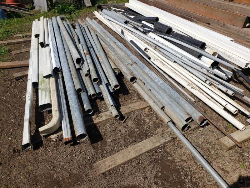 Lots of different kinds of pipe, conduit, downspout pipe. 